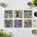 Flat lay de los 6 posavasos gato artístico sobre mármol blanco